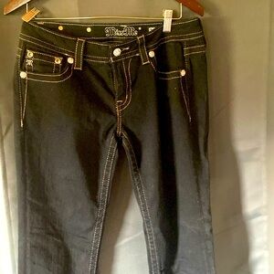 Miss Me black jeans with designs on back pockets. Size 29. Never worn.